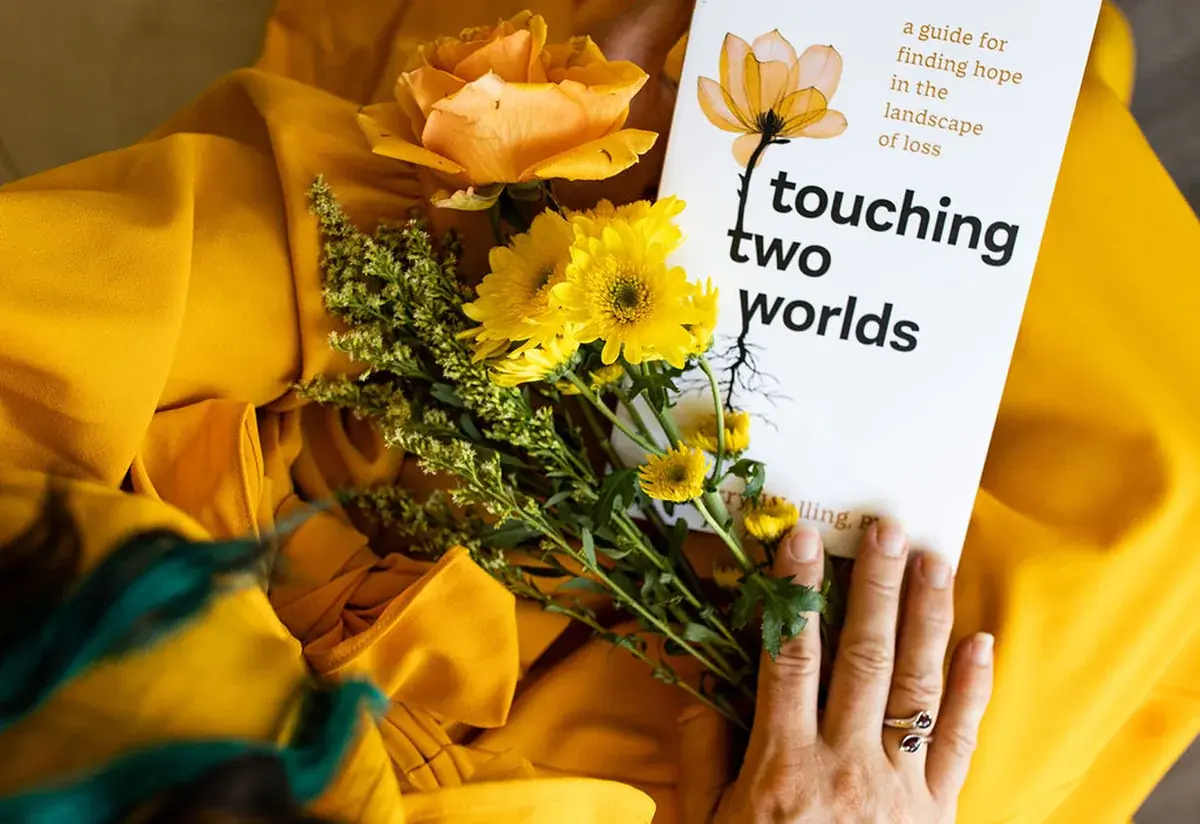 Touching Two Worlds. The IPPY Gold and Nautilus Silver-winning grief book by Dr. Sherry Walling, photographed in close detail